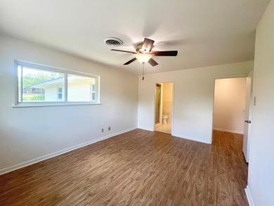 Nicely updated 3/2 brick home perched high for stunning views on Scott Schriener Municipal Golf Course in Texas - for sale on GolfHomes.com, golf home, golf lot