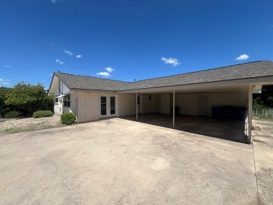 Nicely updated 3/2 brick home perched high for stunning views on Scott Schriener Municipal Golf Course in Texas - for sale on GolfHomes.com, golf home, golf lot