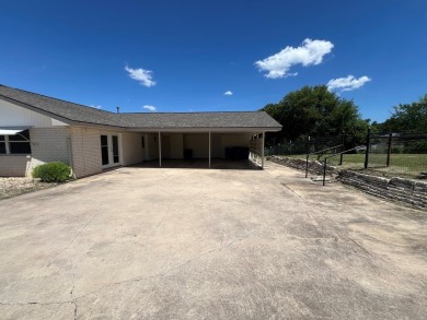 Nicely updated 3/2 brick home perched high for stunning views on Scott Schriener Municipal Golf Course in Texas - for sale on GolfHomes.com, golf home, golf lot