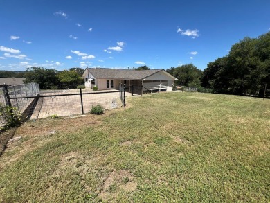 Nicely updated 3/2 brick home perched high for stunning views on Scott Schriener Municipal Golf Course in Texas - for sale on GolfHomes.com, golf home, golf lot