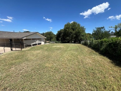 Nicely updated 3/2 brick home perched high for stunning views on Scott Schriener Municipal Golf Course in Texas - for sale on GolfHomes.com, golf home, golf lot