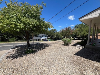Nicely updated 3/2 brick home perched high for stunning views on Scott Schriener Municipal Golf Course in Texas - for sale on GolfHomes.com, golf home, golf lot