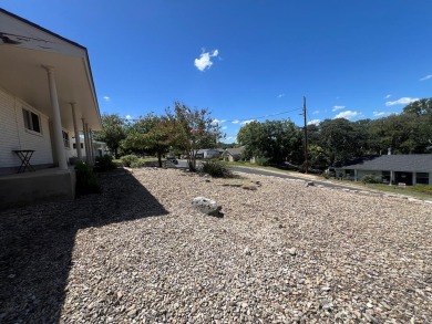 Nicely updated 3/2 brick home perched high for stunning views on Scott Schriener Municipal Golf Course in Texas - for sale on GolfHomes.com, golf home, golf lot