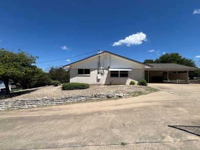 Nicely updated 3/2 brick home perched high for stunning views on Scott Schriener Municipal Golf Course in Texas - for sale on GolfHomes.com, golf home, golf lot