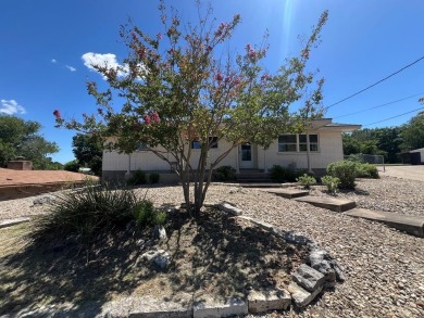 Nicely updated 3/2 brick home perched high for stunning views on Scott Schriener Municipal Golf Course in Texas - for sale on GolfHomes.com, golf home, golf lot