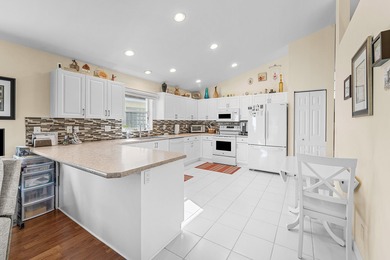 Pride of ownership shines in this immaculate, well-maintained on Cypress Lakes Golf Course - West Palm Beach in Florida - for sale on GolfHomes.com, golf home, golf lot