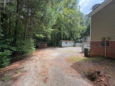 I am pleased to present an exceptional property located directly on South Hill Country Club in Virginia - for sale on GolfHomes.com, golf home, golf lot