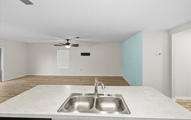 Located in the golf-cart-friendly Grand Reserve Golf Community on Grand Reserve Golf Course in Florida - for sale on GolfHomes.com, golf home, golf lot