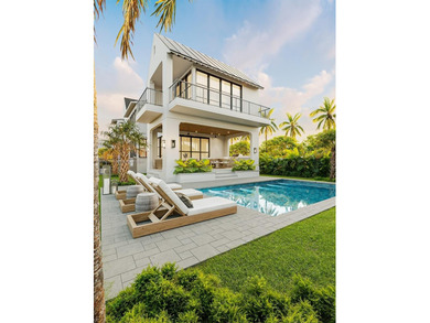 This is the one you've been waiting for, a brand new custom home on La Gorce Country Club in Florida - for sale on GolfHomes.com, golf home, golf lot