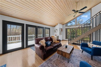 Experience the best of cabin comfort and modern design in this on Voyager Village Country Club - Voyager in Wisconsin - for sale on GolfHomes.com, golf home, golf lot