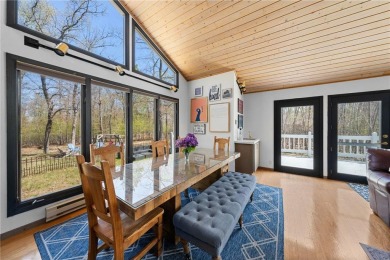 Experience the best of cabin comfort and modern design in this on Voyager Village Country Club - Voyager in Wisconsin - for sale on GolfHomes.com, golf home, golf lot