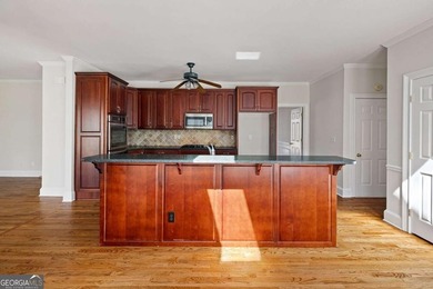 Tucked away on a quiet, double cul-de-sac street in Brookstone on Brookstone Golf and Country Club in Georgia - for sale on GolfHomes.com, golf home, golf lot