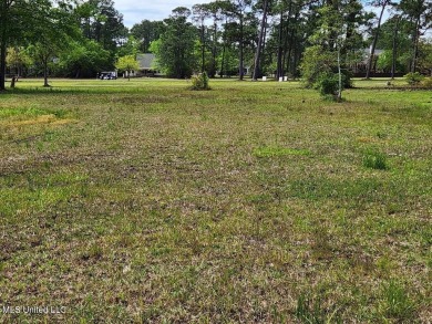 This beautiful lot is waiting on its permanent home build on Pass Christian Isles Golf Club in Mississippi - for sale on GolfHomes.com, golf home, golf lot