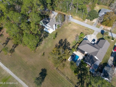 This beautiful lot is waiting on its permanent home build on Pass Christian Isles Golf Club in Mississippi - for sale on GolfHomes.com, golf home, golf lot