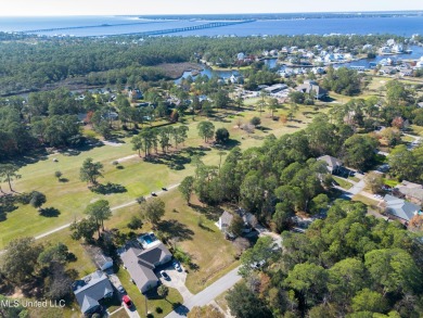 This beautiful lot is waiting on its permanent home build on Pass Christian Isles Golf Club in Mississippi - for sale on GolfHomes.com, golf home, golf lot