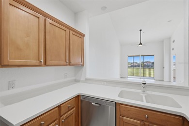 This move-in ready, second-floor 2-bedroom, 2-bath condo offers on Stoneybrook Golf Club At Heritage Harbour in Florida - for sale on GolfHomes.com, golf home, golf lot