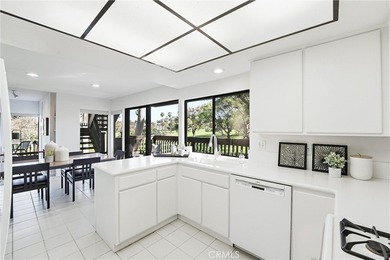 WOW. The door opens, and your attention is immediately drawn on Rancho San Joaquin Golf Course in California - for sale on GolfHomes.com, golf home, golf lot