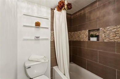 Experience city living at its best in this beautifully on Bobby Jones Golf Club in Georgia - for sale on GolfHomes.com, golf home, golf lot