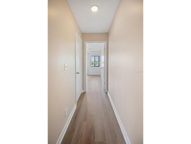 Don't miss this rare opportunity to own a light-filled on Palm Harbor Golf Club in Florida - for sale on GolfHomes.com, golf home, golf lot