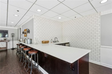 Experience city living at its best in this beautifully on Bobby Jones Golf Club in Georgia - for sale on GolfHomes.com, golf home, golf lot