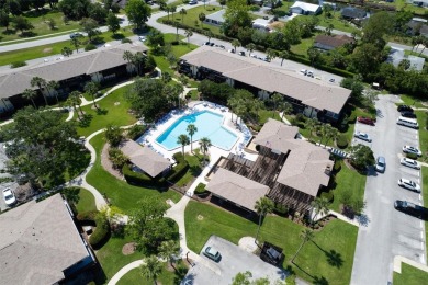 Don't miss this rare opportunity to own a light-filled on Palm Harbor Golf Club in Florida - for sale on GolfHomes.com, golf home, golf lot