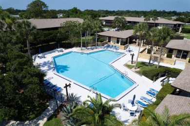 Don't miss this rare opportunity to own a light-filled on Palm Harbor Golf Club in Florida - for sale on GolfHomes.com, golf home, golf lot