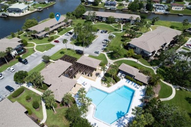 Don't miss this rare opportunity to own a light-filled on Palm Harbor Golf Club in Florida - for sale on GolfHomes.com, golf home, golf lot