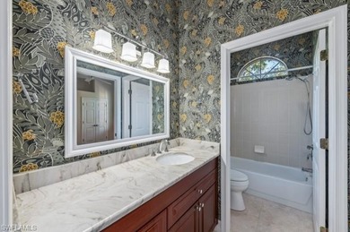 Set on a desirable corner lot with serene water and lush on Bonita Bay West in Florida - for sale on GolfHomes.com, golf home, golf lot