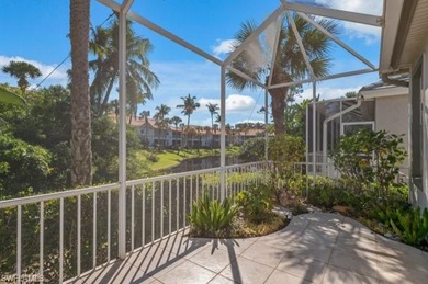 Set on a desirable corner lot with serene water and lush on Bonita Bay West in Florida - for sale on GolfHomes.com, golf home, golf lot