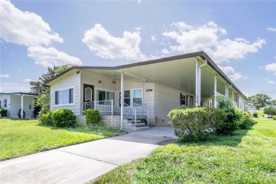 Well-maintained 2-bedroom, 2-bath manufactured home located in on Zellwood Station Country Club in Florida - for sale on GolfHomes.com, golf home, golf lot
