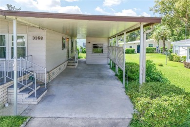 Well-maintained 2-bedroom, 2-bath manufactured home located in on Zellwood Station Country Club in Florida - for sale on GolfHomes.com, golf home, golf lot