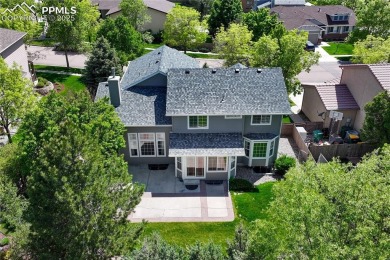 Nestled on a tree-lined street in the heart of District 20 and on Pine Creek Golf Club in Colorado - for sale on GolfHomes.com, golf home, golf lot