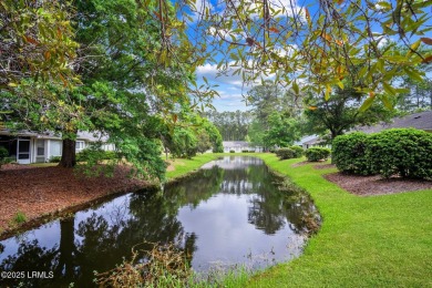Light-Filled One-Level End Unit in Sun City! Tucked in a quiet on Okatie Creek Golf Club in South Carolina - for sale on GolfHomes.com, golf home, golf lot