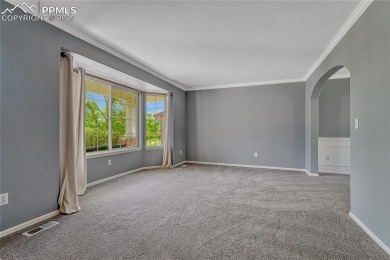 Nestled on a tree-lined street in the heart of District 20 and on Pine Creek Golf Club in Colorado - for sale on GolfHomes.com, golf home, golf lot
