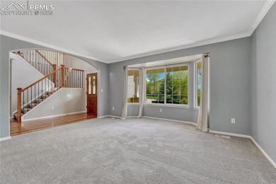 Nestled on a tree-lined street in the heart of District 20 and on Pine Creek Golf Club in Colorado - for sale on GolfHomes.com, golf home, golf lot