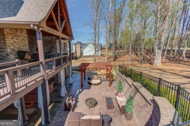 Welcome to refined elegance in this 5 BR/5 BA home on the 10th on Traditions of Braselton Golf Club in Georgia - for sale on GolfHomes.com, golf home, golf lot