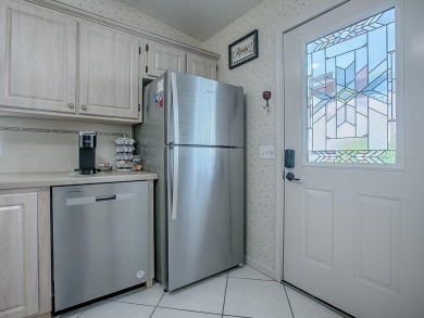 In the heart of The Villages, an exquisite retreat awaits those on El Diablo Executive Golf Course in Florida - for sale on GolfHomes.com, golf home, golf lot