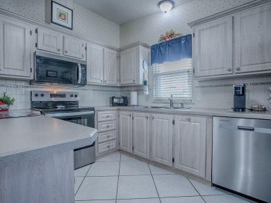 In the heart of The Villages, an exquisite retreat awaits those on El Diablo Executive Golf Course in Florida - for sale on GolfHomes.com, golf home, golf lot