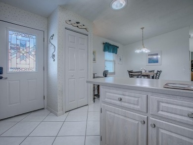 In the heart of The Villages, an exquisite retreat awaits those on El Diablo Executive Golf Course in Florida - for sale on GolfHomes.com, golf home, golf lot