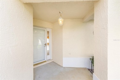 Charming, Block  Stucco, Courtyard Villa on a Corner Lot in on The Links of Spruce Creek in Florida - for sale on GolfHomes.com, golf home, golf lot