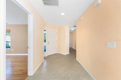 Charming, Block  Stucco, Courtyard Villa on a Corner Lot in on The Links of Spruce Creek in Florida - for sale on GolfHomes.com, golf home, golf lot
