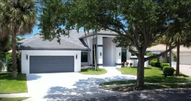 This fully renovated contemporary estate is nestled in the on Broken Sound Golf and Club  in Florida - for sale on GolfHomes.com, golf home, golf lot