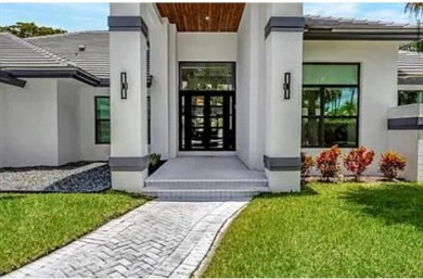 This fully renovated contemporary estate is nestled in the on Broken Sound Golf and Club  in Florida - for sale on GolfHomes.com, golf home, golf lot