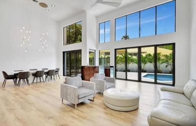 This fully renovated contemporary estate is nestled in the on Broken Sound Golf and Club  in Florida - for sale on GolfHomes.com, golf home, golf lot