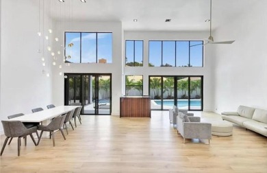 This fully renovated contemporary estate is nestled in the on Broken Sound Golf and Club  in Florida - for sale on GolfHomes.com, golf home, golf lot