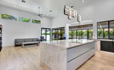 This fully renovated contemporary estate is nestled in the on Broken Sound Golf and Club  in Florida - for sale on GolfHomes.com, golf home, golf lot