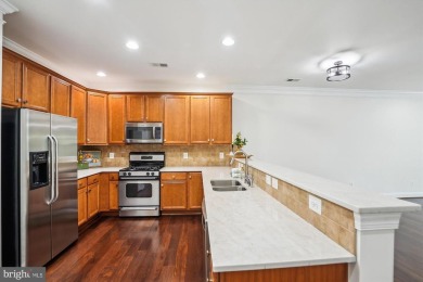 Are you ready for low maintenance and main level living, but on Regency At Dominion Valley Country Club in Virginia - for sale on GolfHomes.com, golf home, golf lot