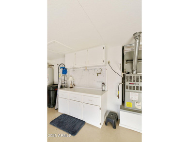 Significantly altered 3BR, 2BA Solano model on the walking path on Oakwood Golf Club  in Arizona - for sale on GolfHomes.com, golf home, golf lot