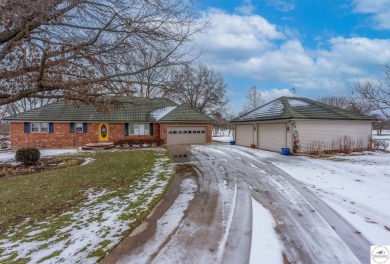 This exquisite 1.5-story, 3-bedroom, 3.5 bath home offers luxury on Sedalia Country Club in Missouri - for sale on GolfHomes.com, golf home, golf lot