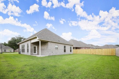 Situated in the prestigious Pelican Crossing subdivision on Pelican Point Golf Club in Louisiana - for sale on GolfHomes.com, golf home, golf lot